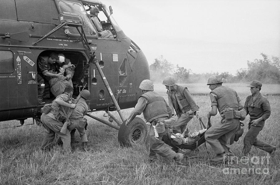 Marines With Wounded Soldiers Photograph by Bettmann