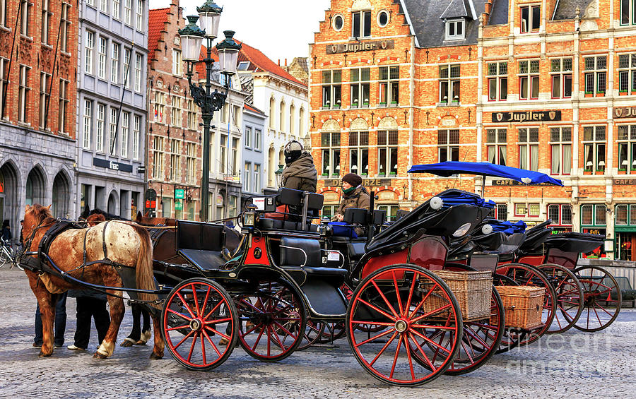 Market Ride at the Market Square Bruges Photograph by John Rizzuto