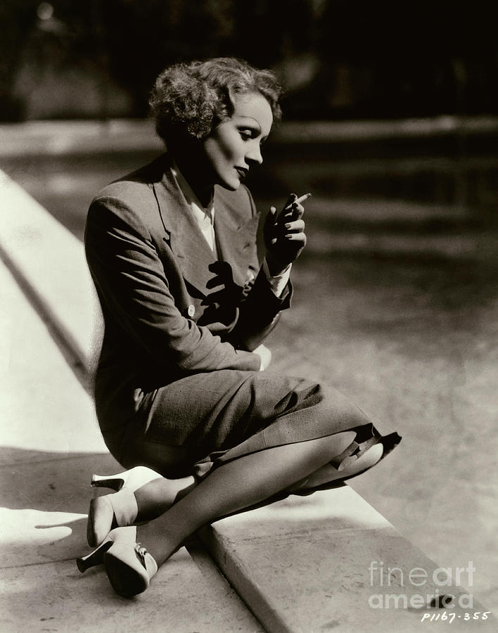 Marlene Dietrich Sitting At Pool Photograph by Bettmann