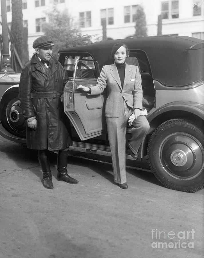 Marlene Dietrich With Chauffeur Photograph by Bettmann