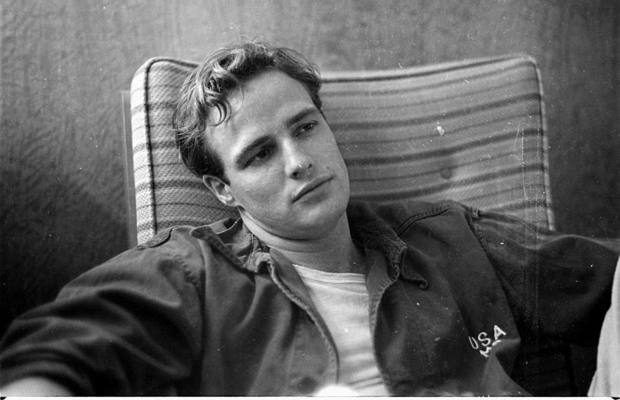 Marlon Brando, sitting on the porch, during the filming of Photograph by Ed Clark