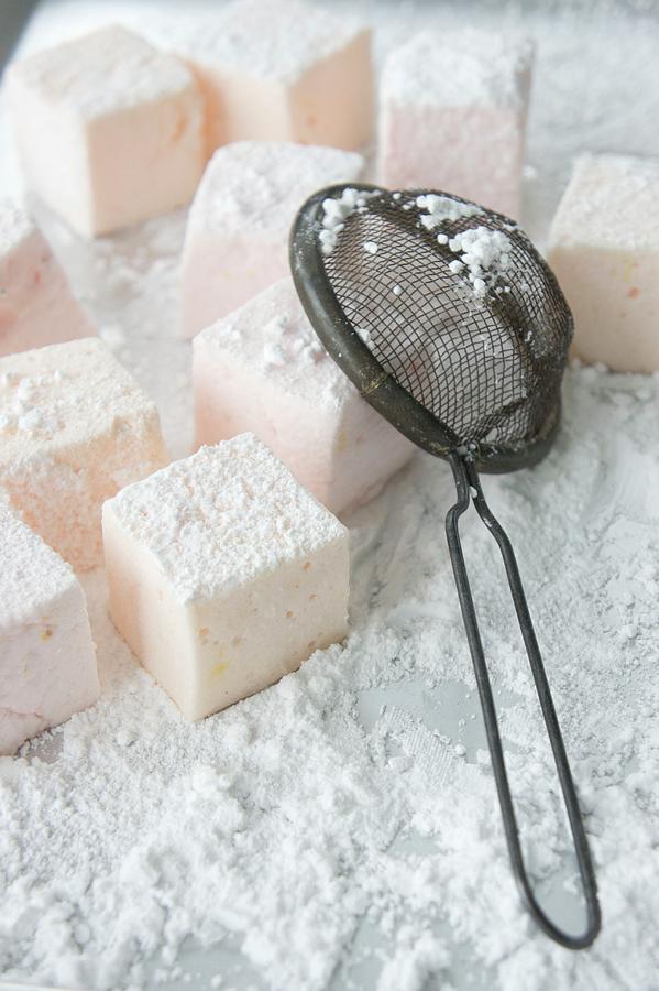 Marshmallows And Icing Sugar Photograph by Martina Schindler
