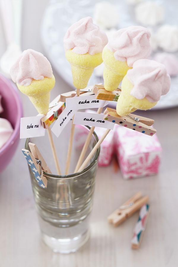 Marshmallows Shaped Like Ice Cream Cones On Skewers With Mottoes On Clothes Pegs Photograph by Franziska Taube