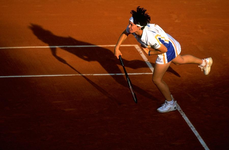 Tennis Photograph - Martina Hingis Of Switzerland Serves by Clive Brunskill