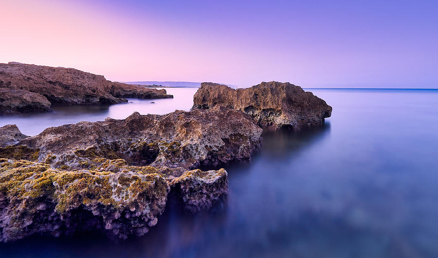 Sunset Photograph - Marzamemi. Rocks On The Shore by Fabio Candido