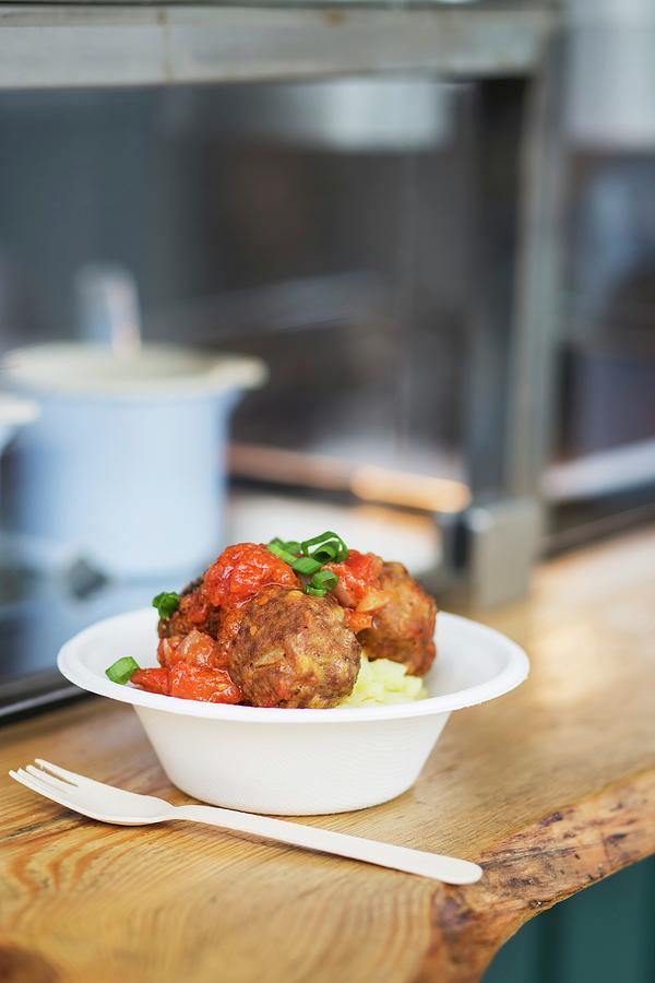 Mashed Potato With Meatballs On The Counter Of A Fast Food Stand Photograph by Jan Wischnewski
