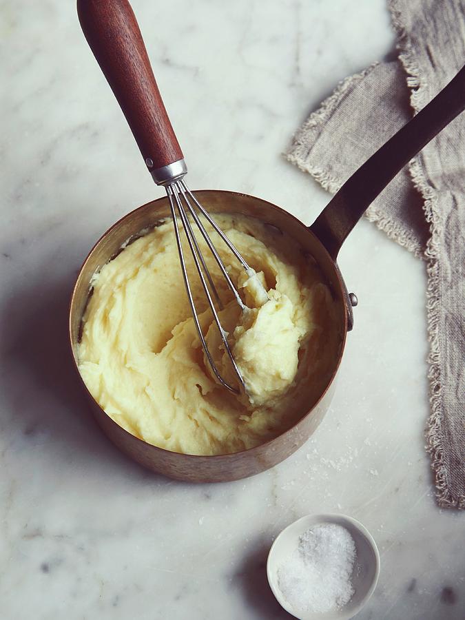 Mashed Potatoes With A Whisk In A Saucepan Photograph by Lukejalbert