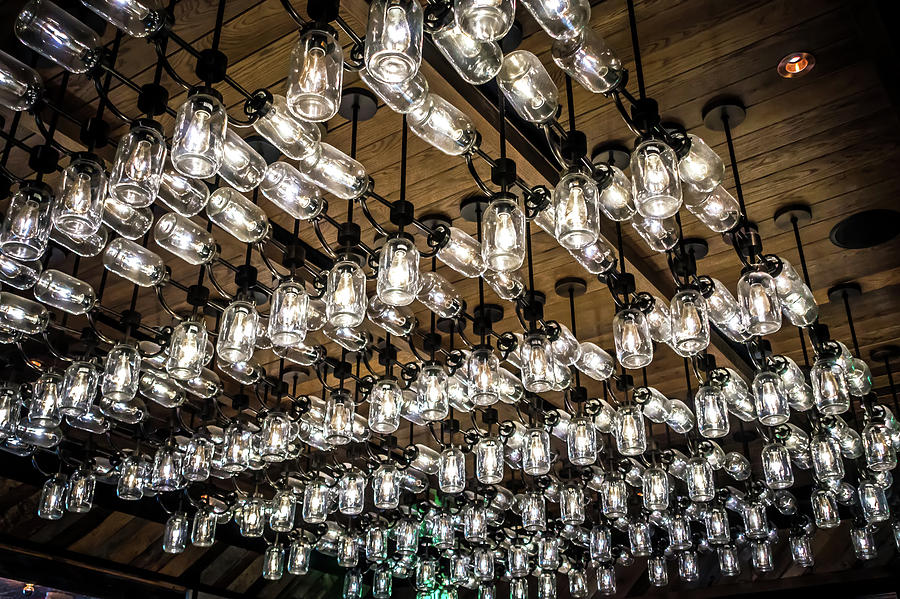 Mason Jar Lights Chandelier Decor At A Restaurant Photograph by Alex Grichenko