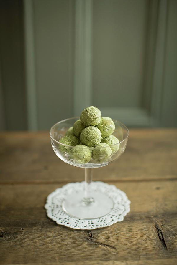 Matcha Tea And Chestnut Truffles In A Dessert Bowl Photograph by Anne Faber