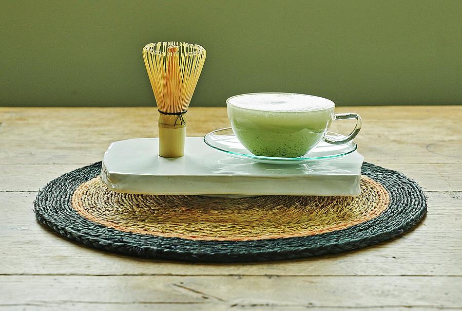 Matcha Tea japanese Green Tea In A Glass With A Tea Whisk Next To It Photograph by Jalag / Bernd Ebsen