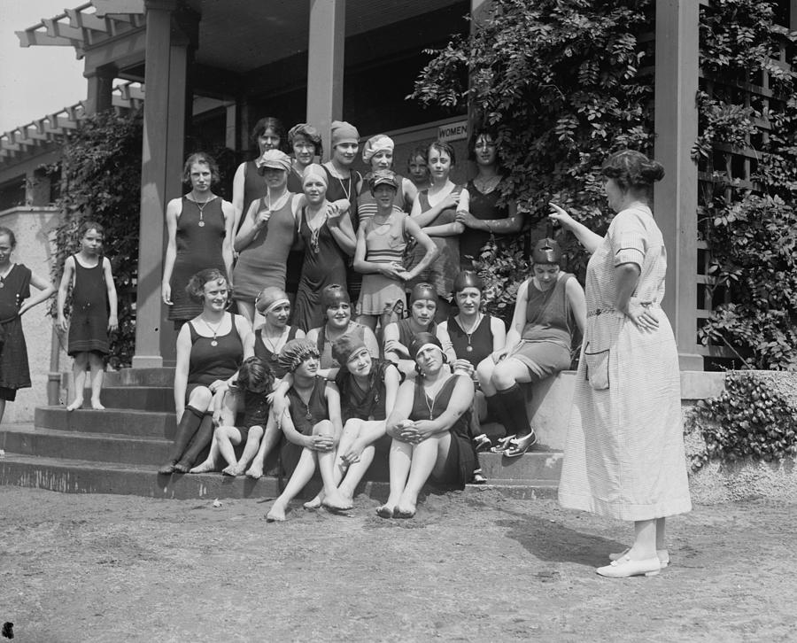 Matron points at Young Girls sitting on the steps of the beach house ...