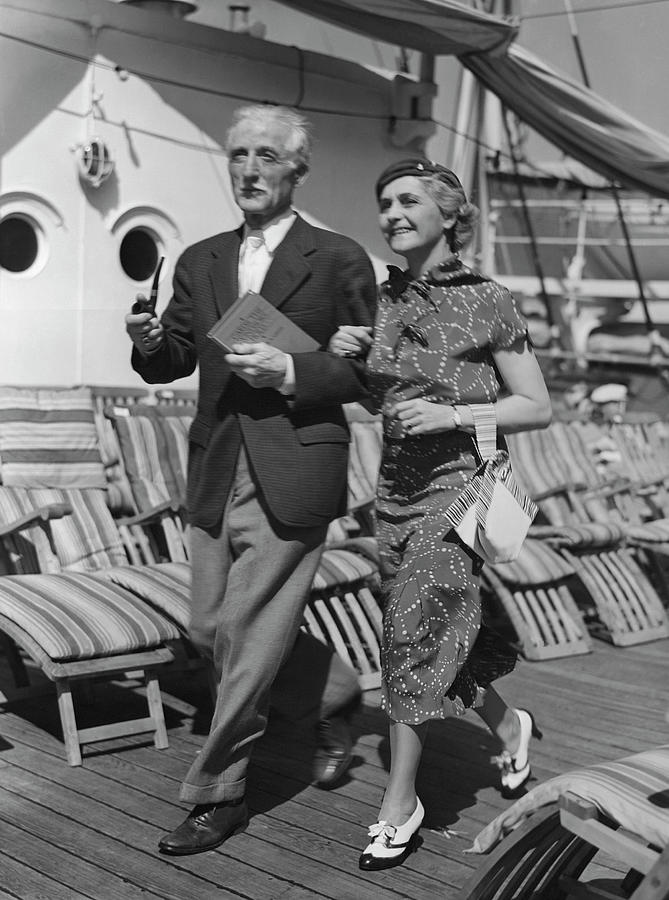 Mature Couple On Deck Of Boat Photograph by George Marks