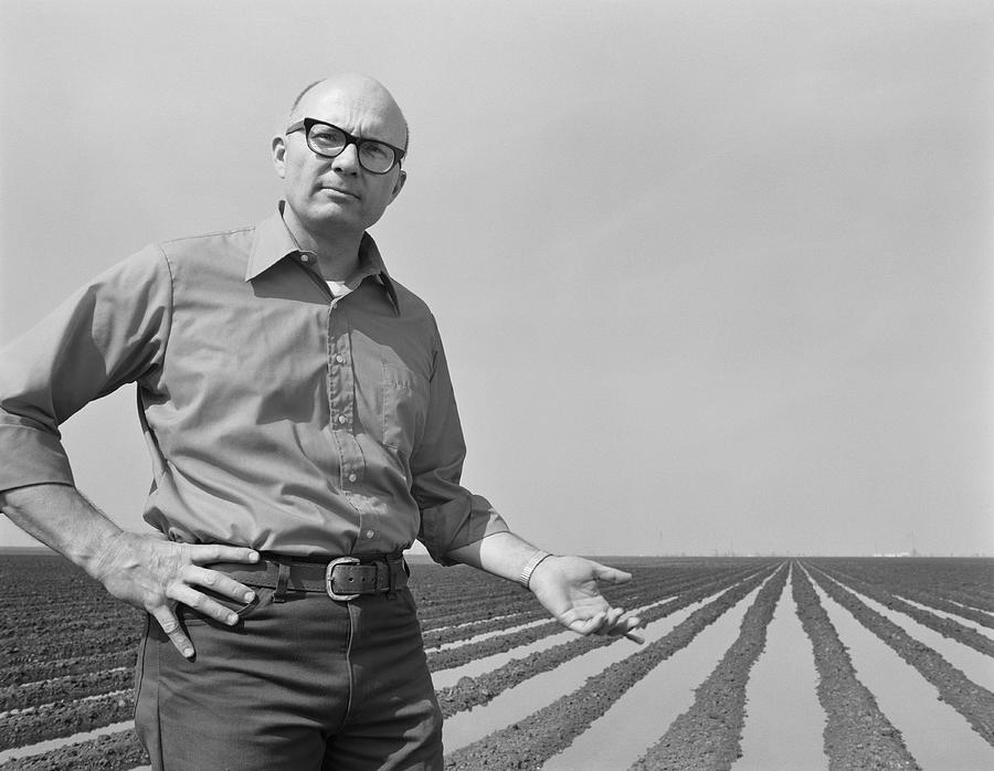 Mature Man Gesturing At Ploughed Field Photograph by Tom Kelley Archive