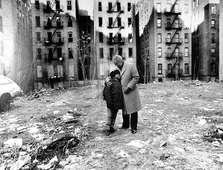 Mayor David N. Dinkins Embraces A Young Photograph by New York Daily News Archive