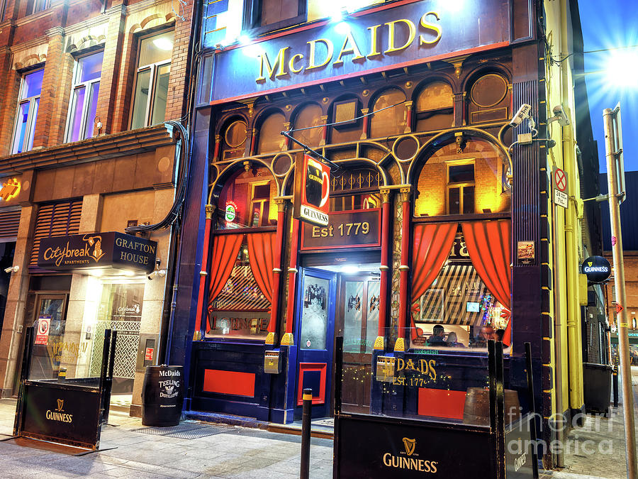 McDaids at Night in Dublin Photograph by John Rizzuto