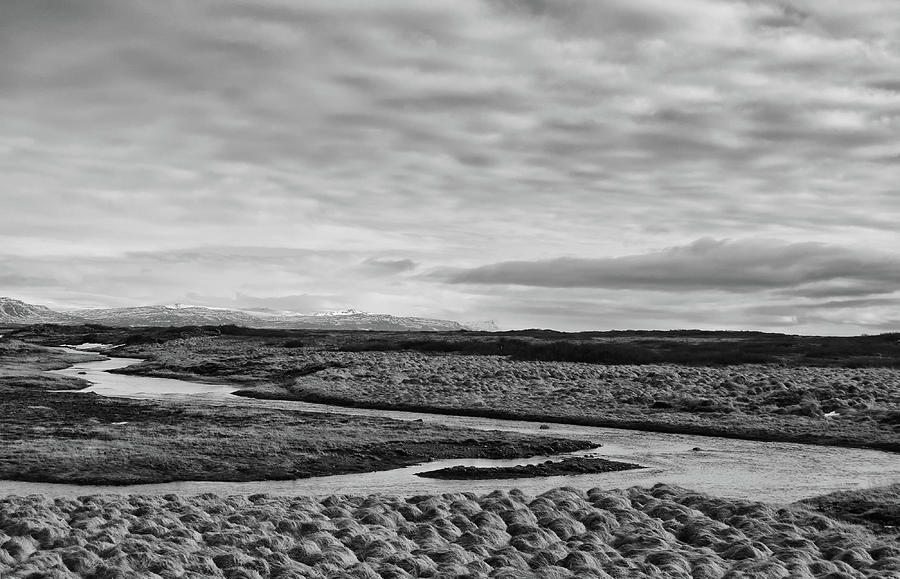 Meandering Stream and Grassland Below Cloudscape Iceland Black and White Photograph by Shawn OBrien