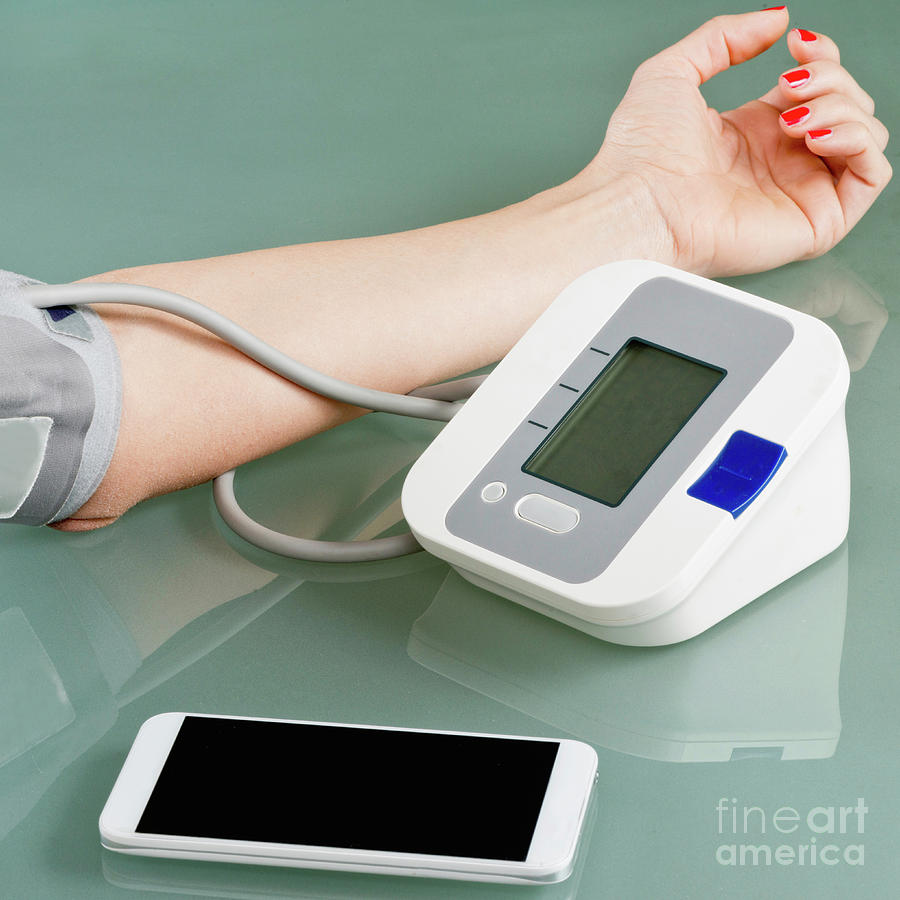 Blood Pressure Gauge Photograph - Measuring Blood Pressure At Home by Microgen Images/science Photo Library
