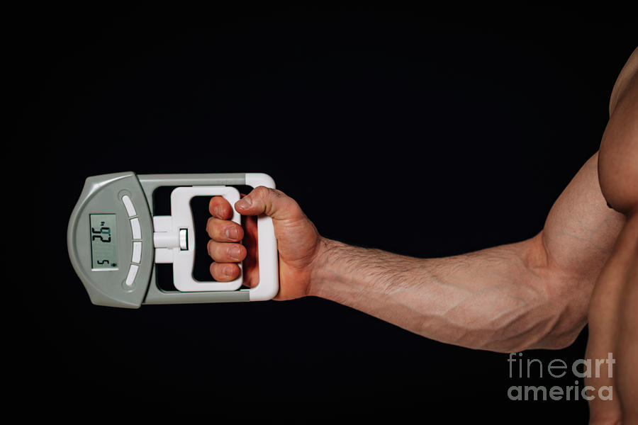 Measuring Grip Strength With Dynamometer Photograph by Microgen Images