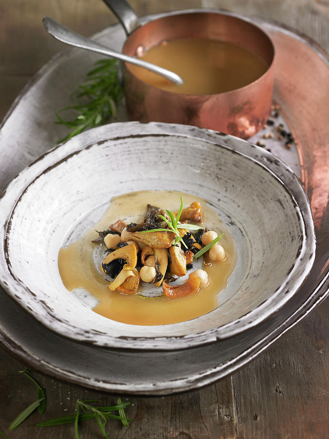 Meat Broth With Mushrooms, Chickpeas And Foie Gras Photograph by Lawton
