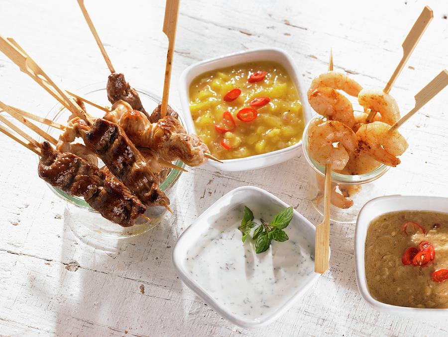Meat, Poultry And Prawn Skewers With Dips Photograph by Barbara Lutterbeck