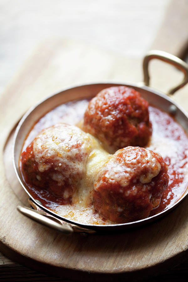Meatballs In A Tomato Sauce Topped With Cheese Photograph by Steven Joyce