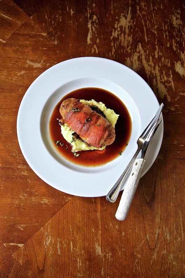 Meatloaf Wrapped In Bacon On Potato And Garlic Mash Photograph by Andre Baranowski