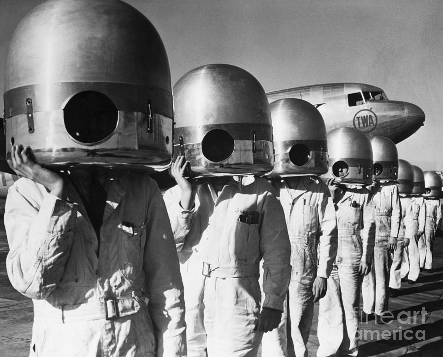 Mechanics With Propeller Hubs On Heads Photograph by Bettmann Mechanics With Propeller Hubs On Heads Photograph by Bettmann