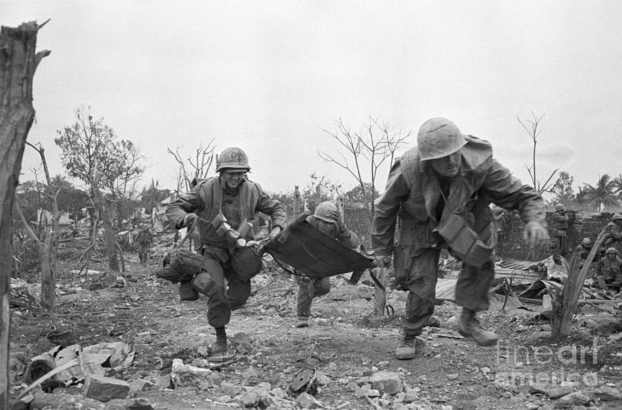 Medic Rushing To Aid Wounded Marine Photograph by Bettmann
