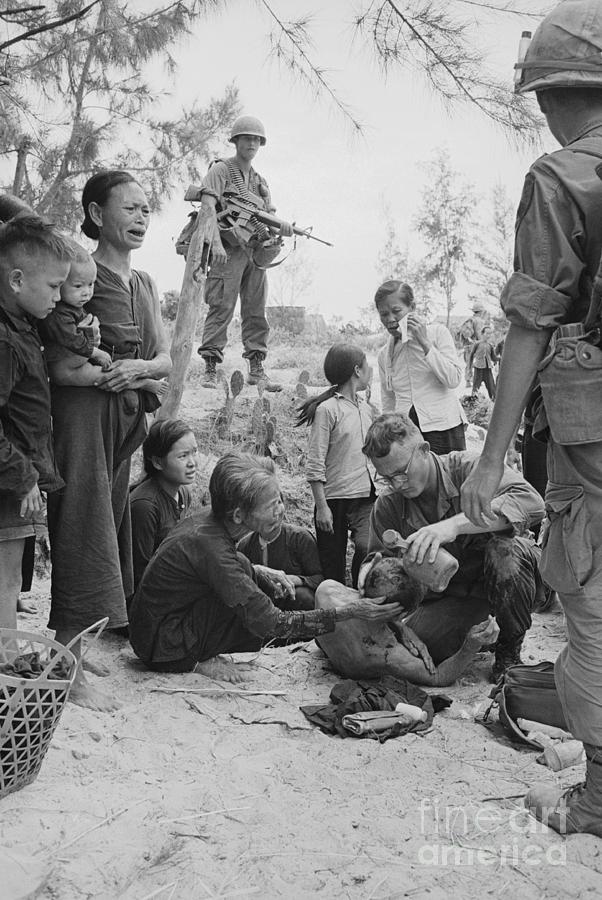 Medic Treating Wounded Vietnamese Photograph by Bettmann