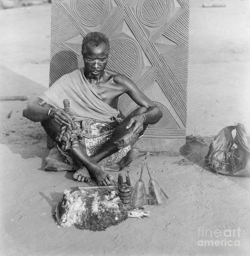 Medicine Man Sitting On Ground Photograph by Bettmann