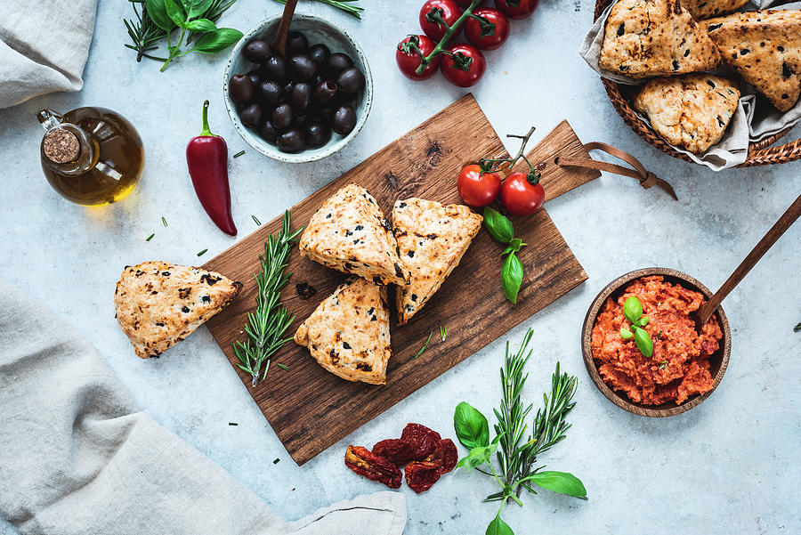 Mediterranean Scones With Spicy Tomato Spread On A Wooden Board Photograph by Christian Kutschka