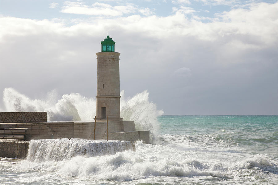 Mediterranean Waters Hitting Lighthouse Photograph by Barry Winiker