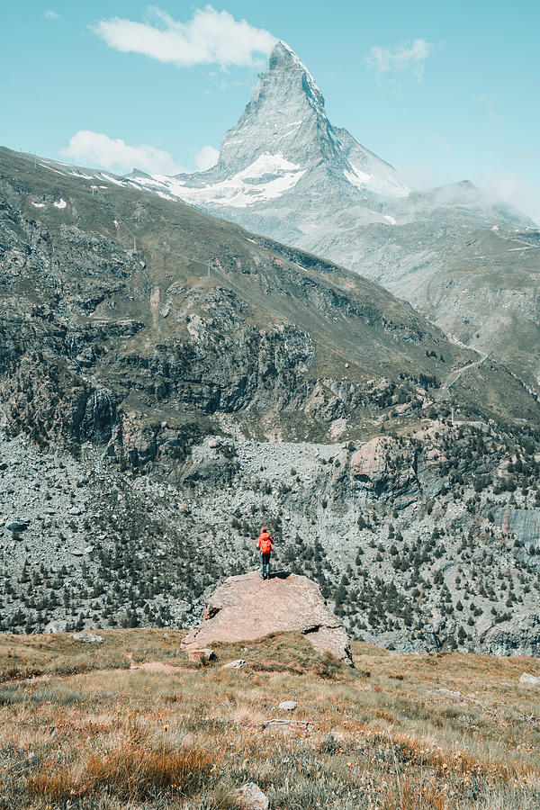 Alpine Photograph - Medium Angle Frame Of Young Woman Standing In Front Of Matterhorn by Cavan Images