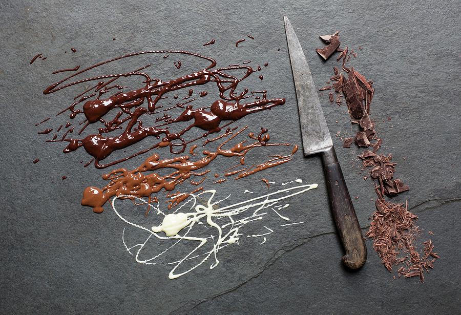 Melted And Chopped Chocolate On A Grey Surface Photograph by Cath Lowe