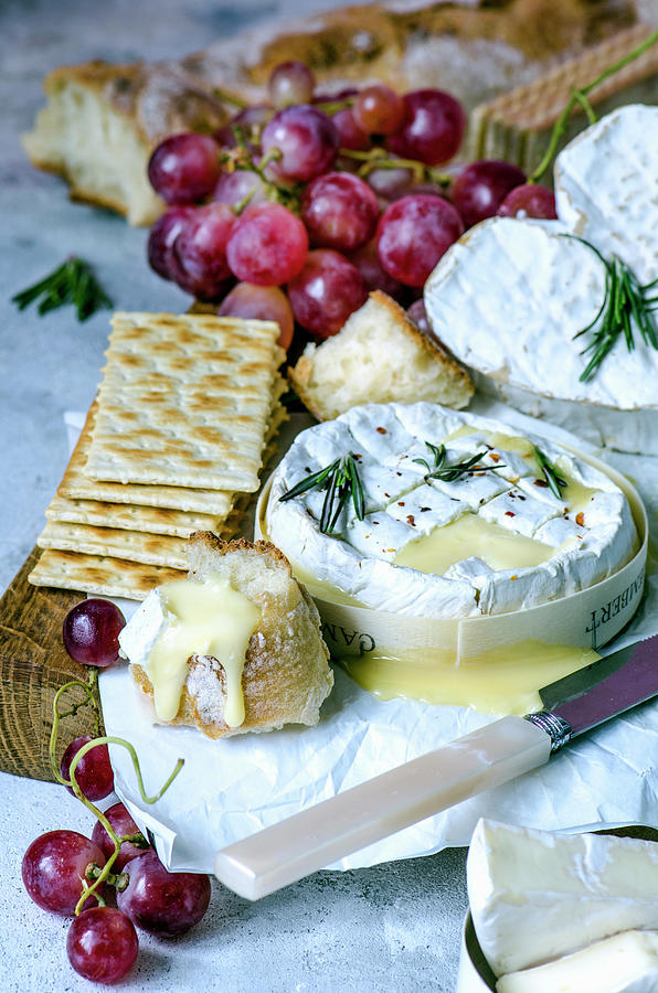 Melted Camembert, Ciabatta, Pink Grapes, Crackers And Rosemary Photograph by Gorobina