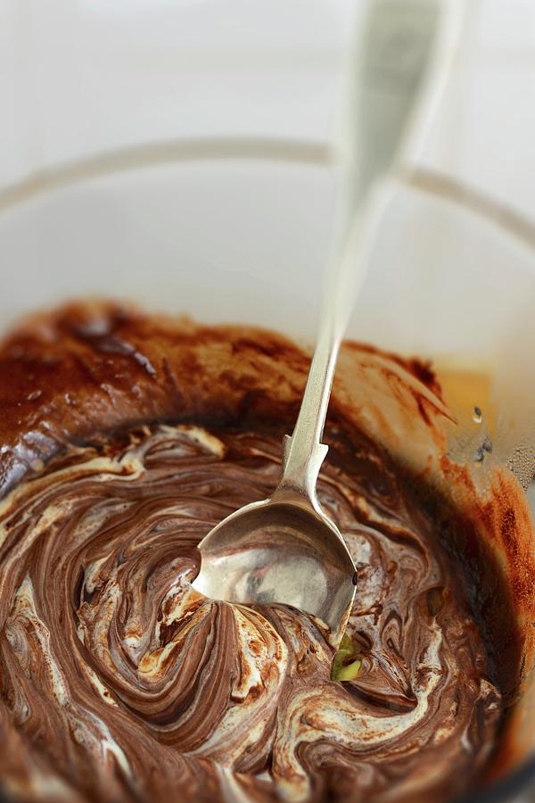 Melted Chocolate In A Bowl With A Spoon Photograph by Roger Stowell