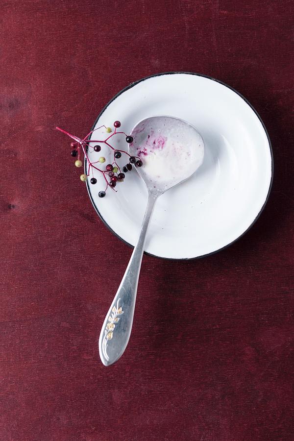 Melted Elderberry Ice Cream On A Spoon On A Plate Photograph by Mandy Reschke