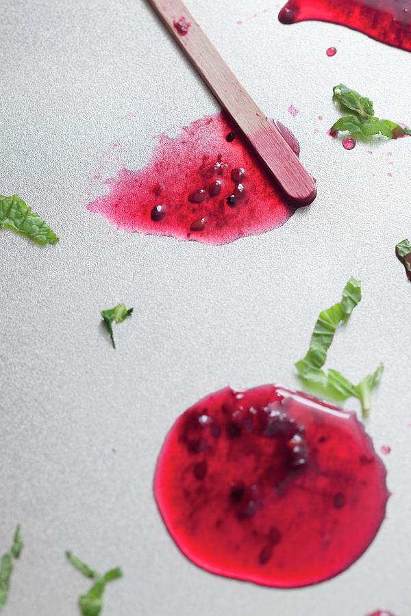 Melted Grapefruit And Blackberry Ice Lollies On A Silver Tray Photograph by Katharine Pollak