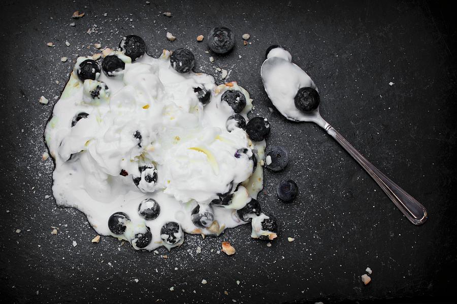 Melted Yoghurt Ice Cream With Blueberries And A Teaspoon Photograph by Esther Hildebrandt
