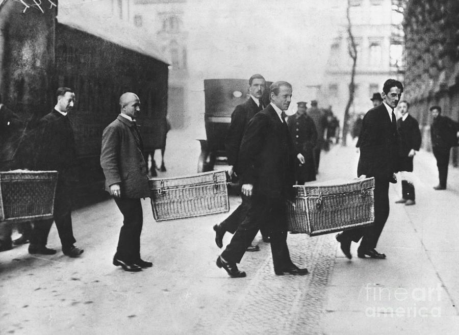 Men Carrying Baskets With Gold To Bank Photograph by Bettmann