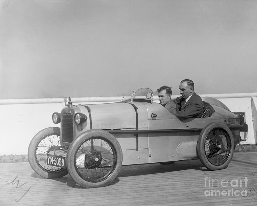 Men Driving Small Automobile Photograph by Bettmann