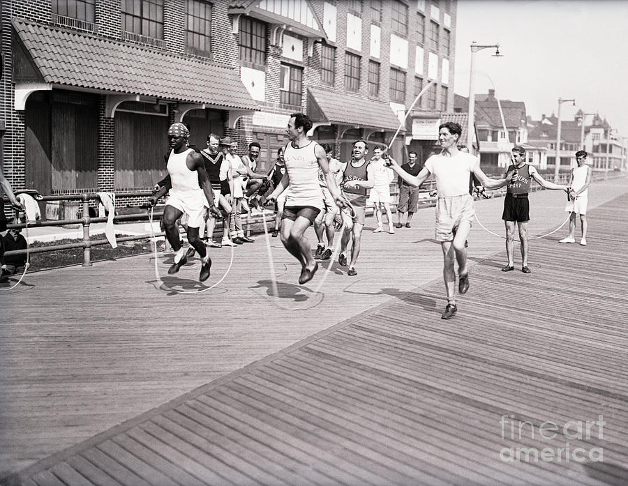 Men Jump Rope Down The Boardwalk Photograph by Bettmann