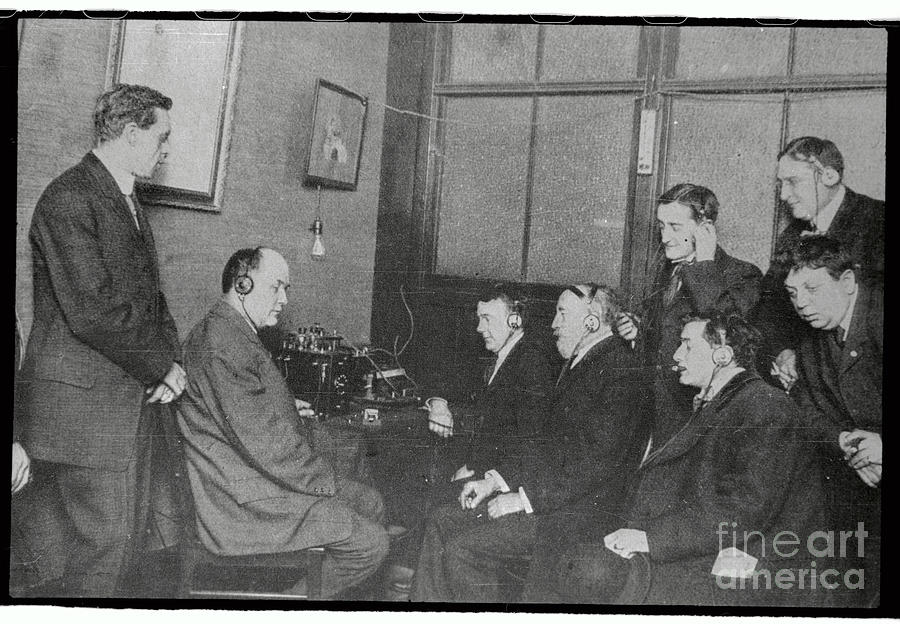 Men Listening To Radio With Earphones Photograph by Bettmann