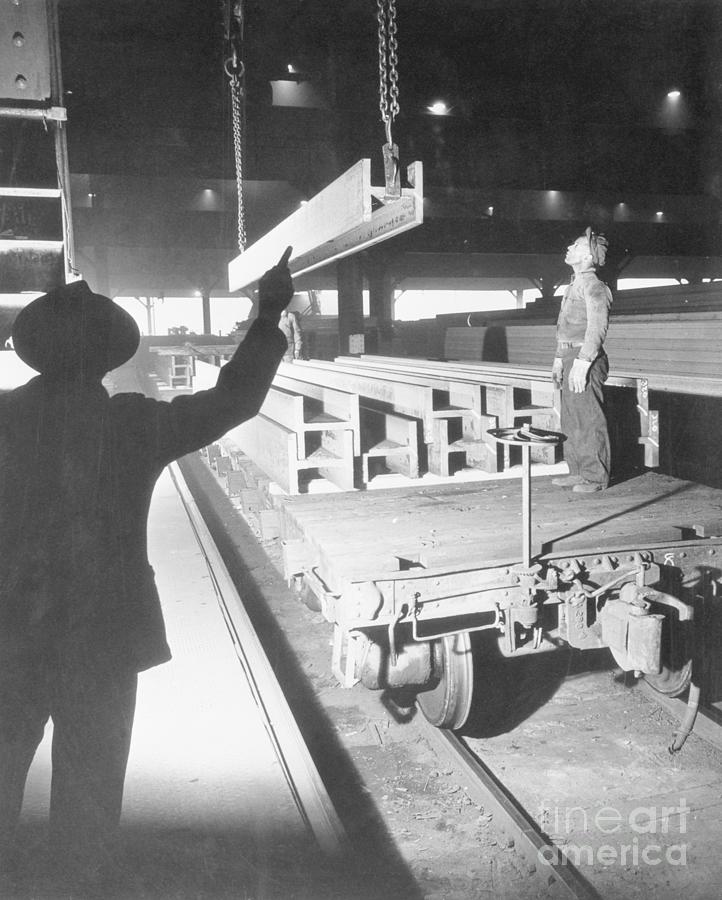 Men Loading Steel Beams Onto R.r. Car Photograph by Bettmann