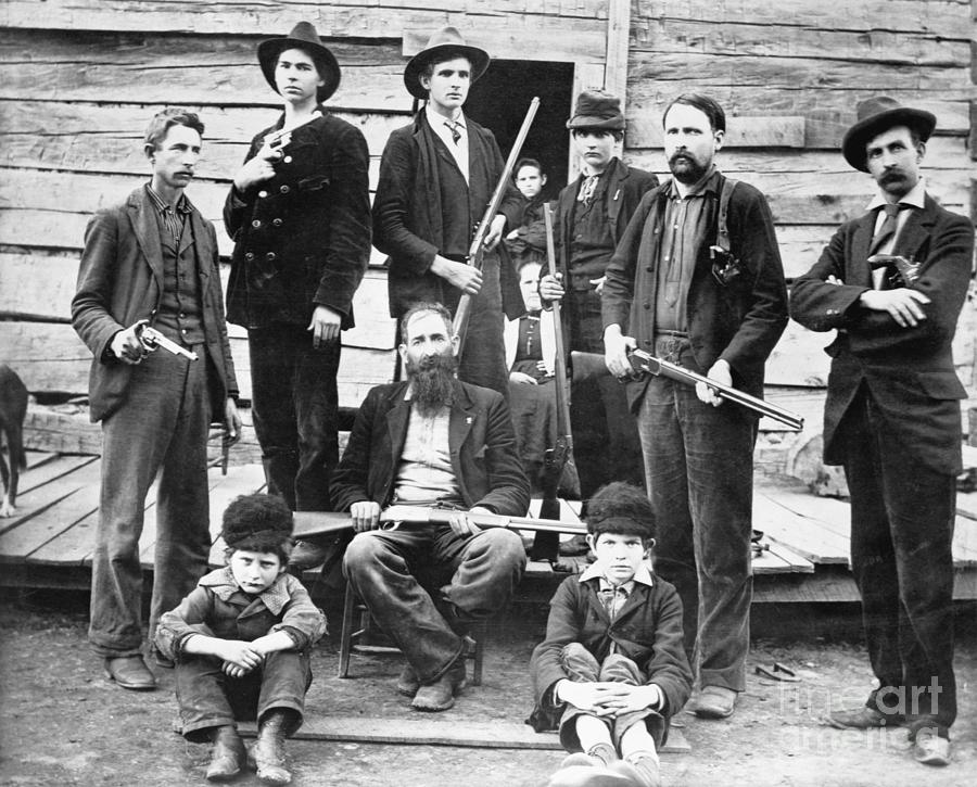 Men Of The Hatfield Family Holding Fire Photograph by Bettmann