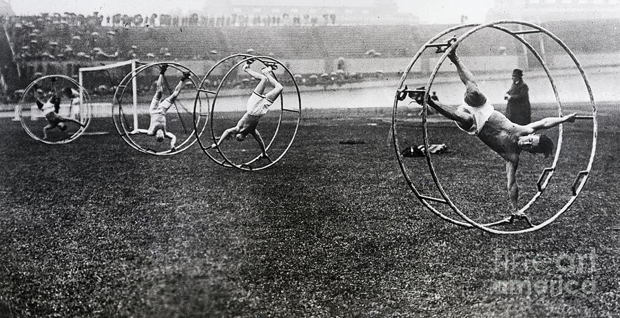 Men Participating In Cat-in-the-wheel Photograph by Bettmann