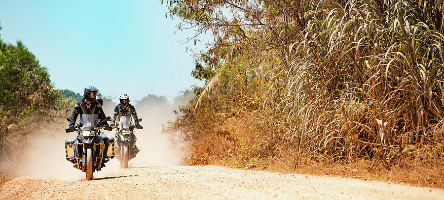 Rural Scene Photograph - Men Riding Their Adventure Motorbikes On Dusty Road In Cambodia by Cavan Images