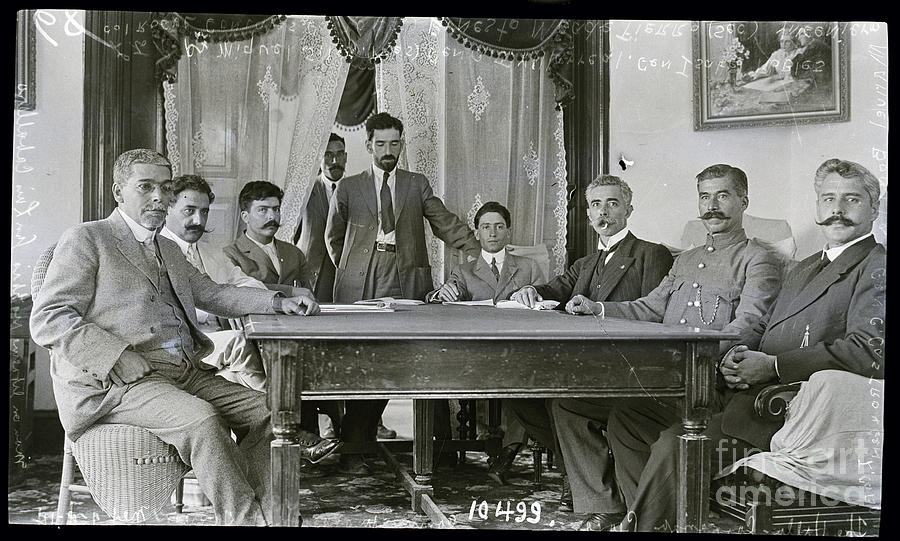 Men Seated At Table Peace Conference Photograph by Bettmann