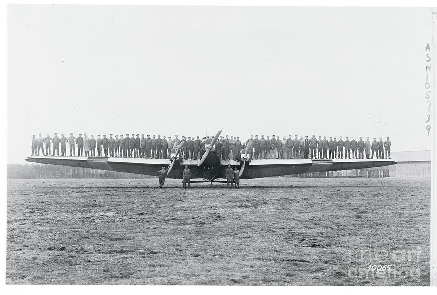 Men Testing A Planes Wing Rigidity Photograph by Bettmann