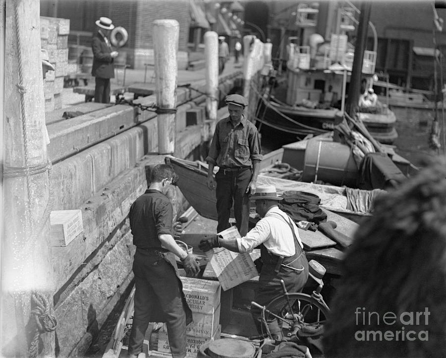 Men Unloading Crates Of Rum Photograph by Bettmann